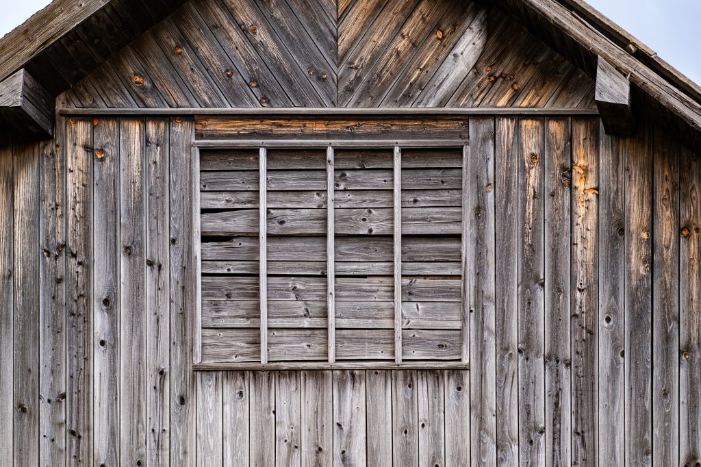 The old building is a wooden barn